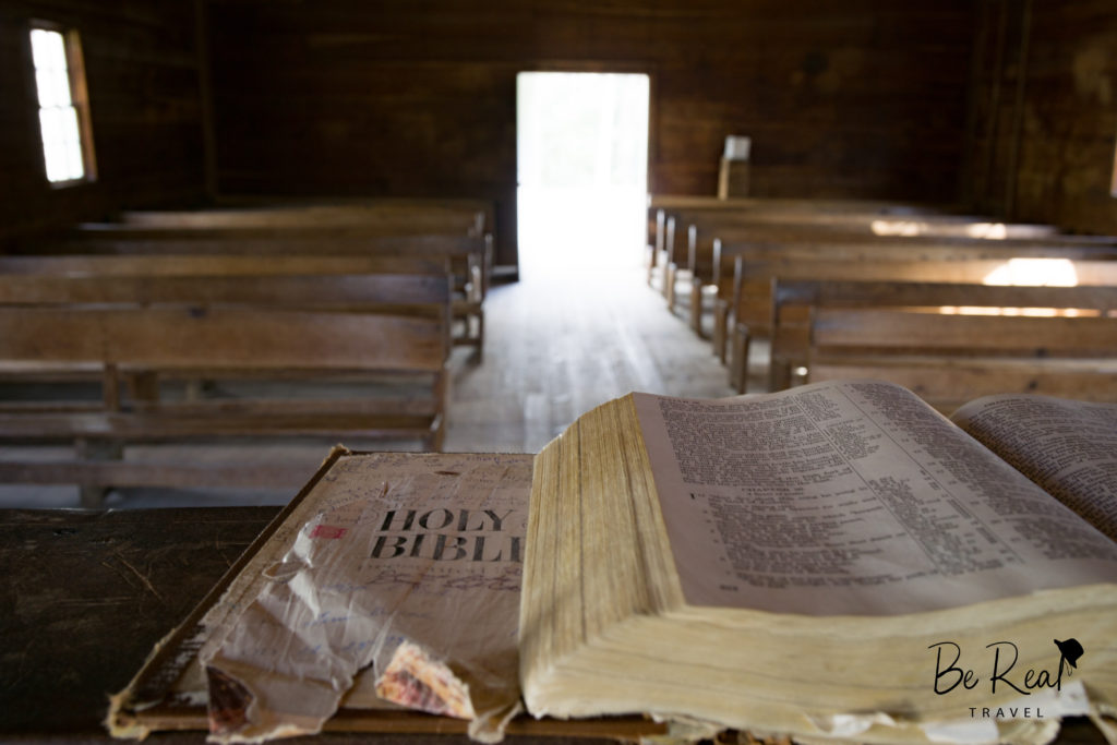 A historic church still contains pews and a bible stand in Great Smoky National Park, Tennessee