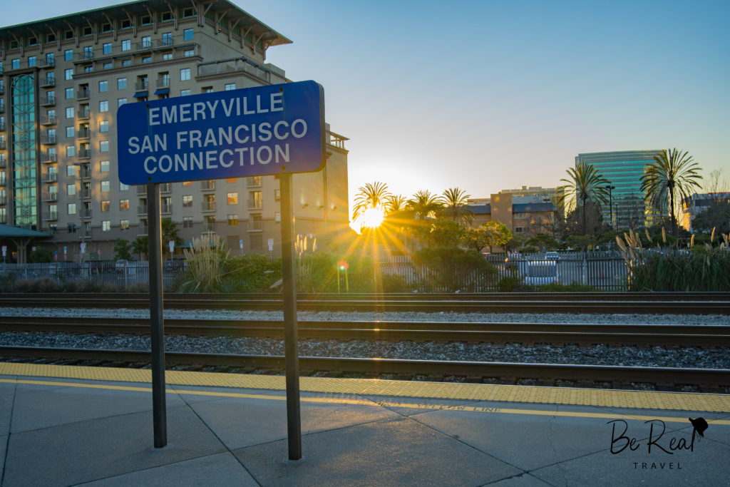 The sun sets beyond Emeryville Station, California