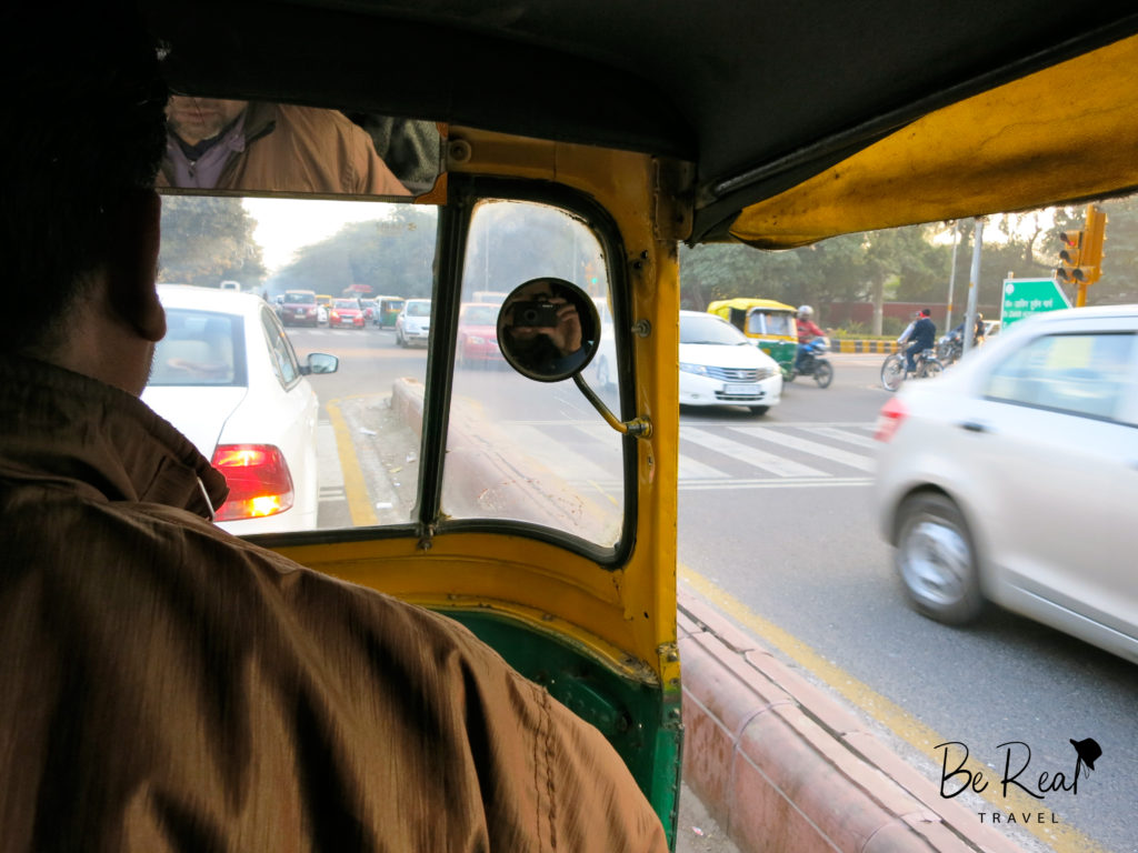 A view from inside an auto rickshaw in Delhi, Tourists admire the Taj Mahal through the fog in Agra, part of India's golden triangle