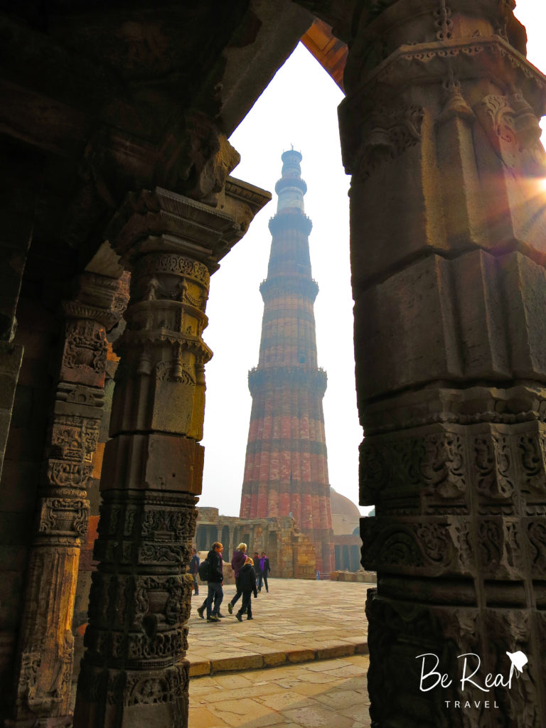 The Qutb Minar towers above visitors in Delhi, Tourists admire the Taj Mahal through the fog in Agra, part of India's golden triangle