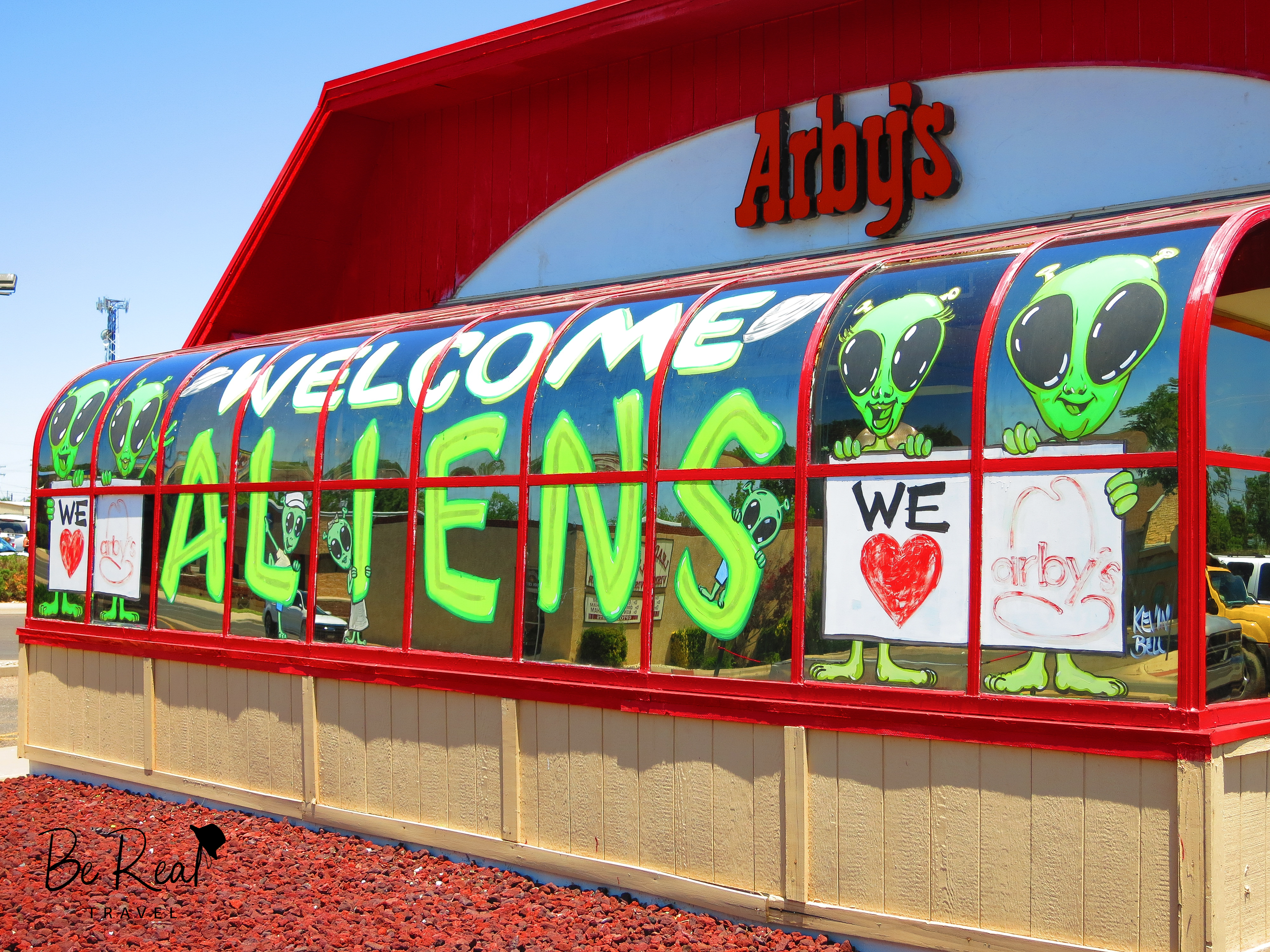 Paintings on an Arby's in Roswell, New Mexico features aliens welcoming visitors