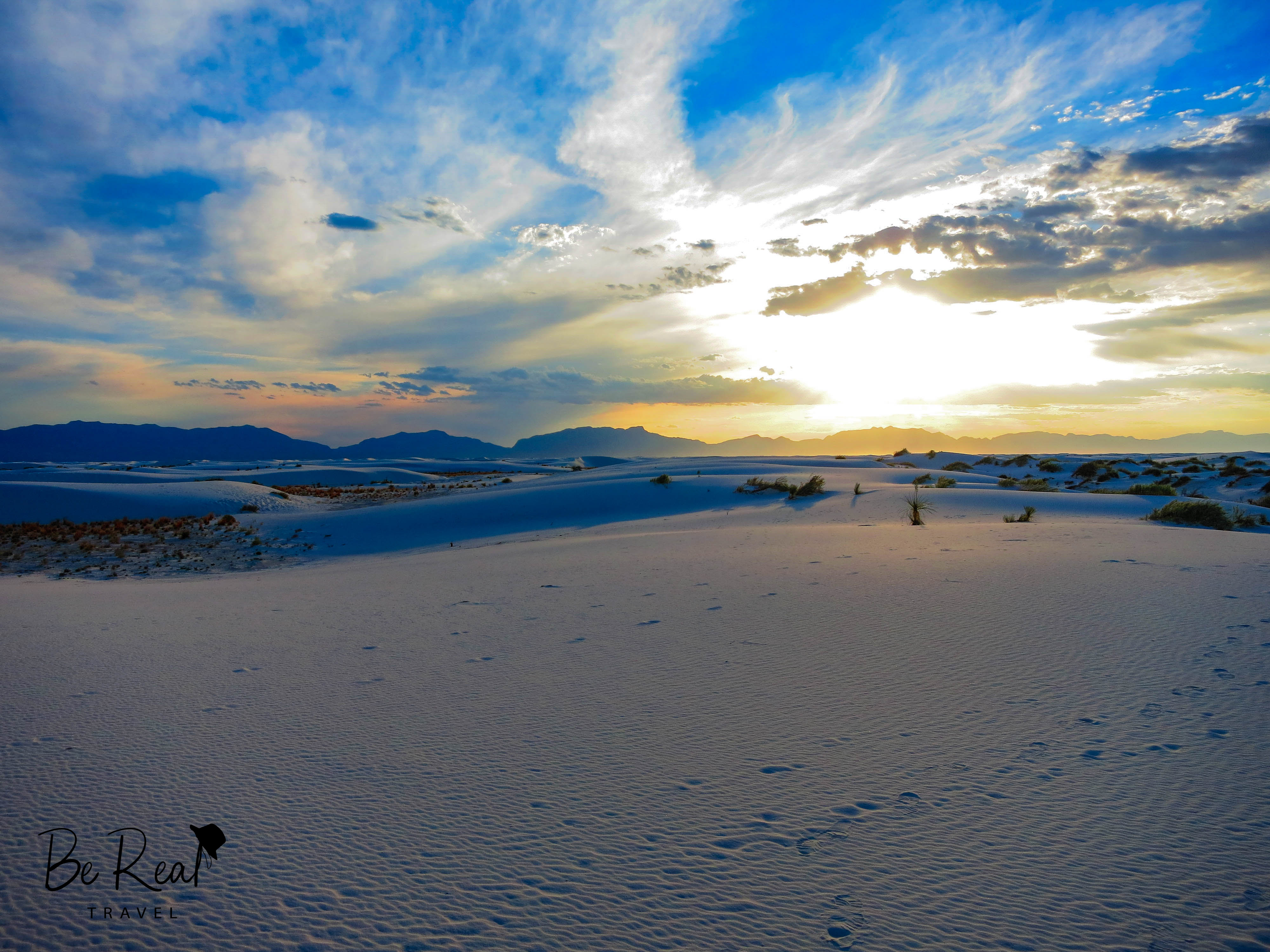 The sun sets above the sand at White Sands National Park, New Mexico